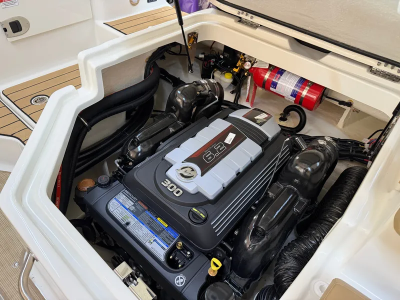 Slide: The Image of The engine compartment of a 2026 Sea Ray SDX 230 features a powerful 300 HP engine. - 21