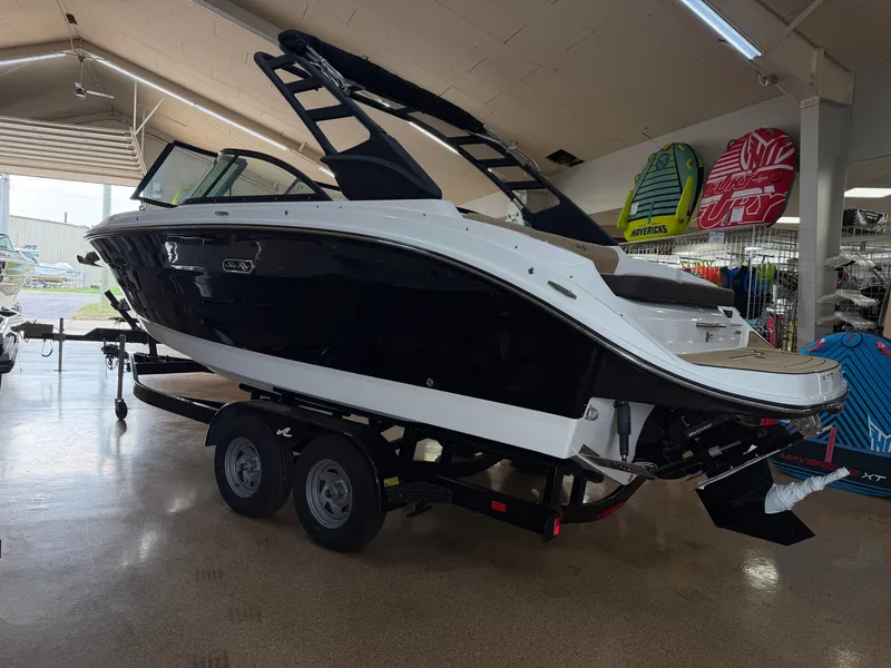 Slide: The Image of A 2026 Sea Ray SDX 230 boat on a trailer in a showroom. - 4