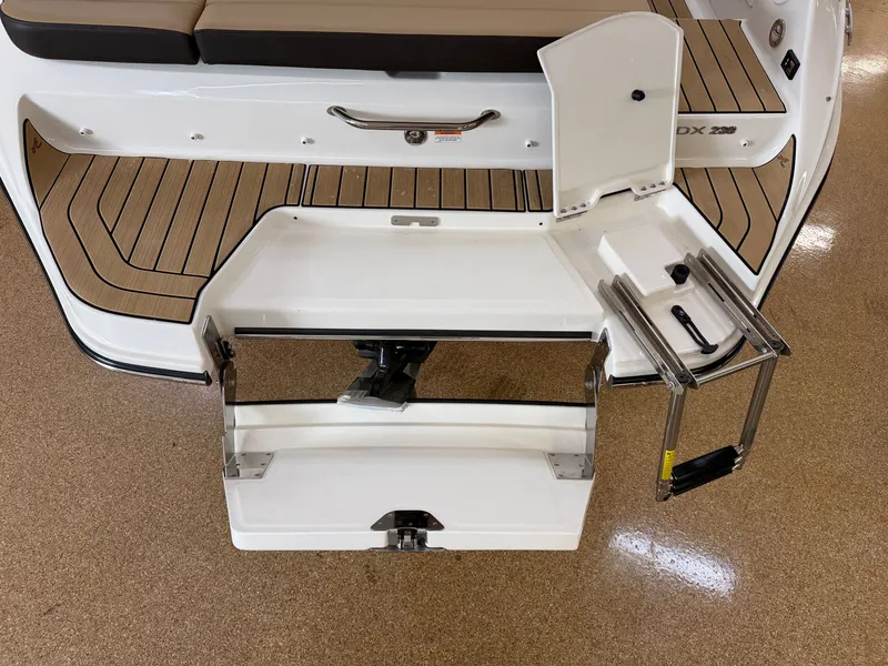 Slide: The Image of Rear view of Sea Ray SDX 230 with fold-out swim platform and ladder. - 9