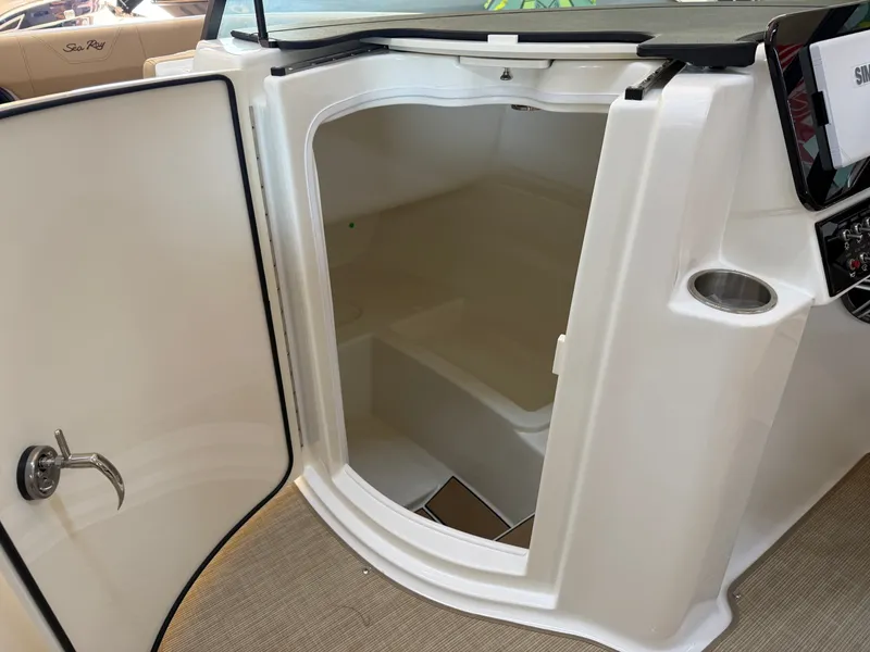 Slide: The Image of Interior of a 2026 Sea Ray SDX 230 with an open door and steps. - 44
