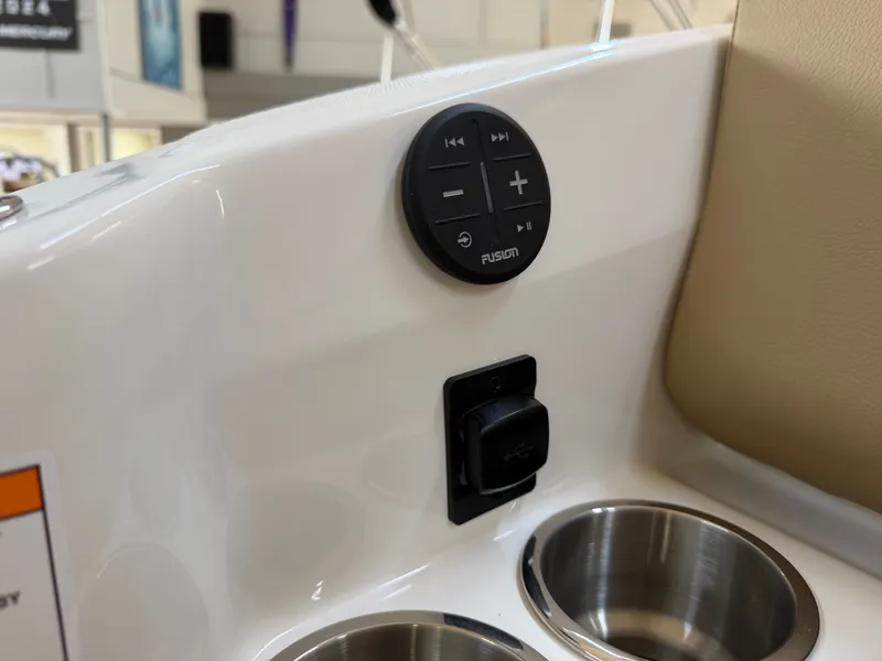 Slide: The Image of Close-up of a boat console area with controls and cup holders. - 12