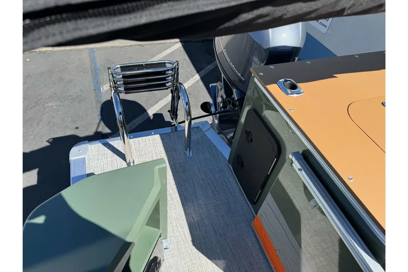 Slide: The Image of 2026 Tahoe Pontoon Geofish RF 21 boat deck with ladder and motor. - 15