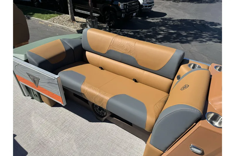Slide: The Image of Luxurious seating on 2026 Tahoe Pontoon Geofish RF 21, featuring tan and gray upholstery. - 28