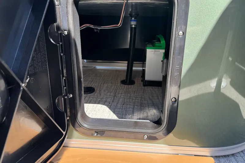 Slide: The Image of Open storage compartment in 2026 Tahoe Pontoon Geofish RF 21 boat. - 36