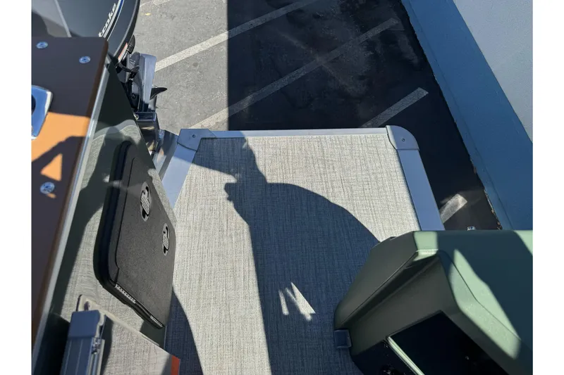 Slide: The Image of 2026 Tahoe Pontoon Geofish RF 21 deck with shadow and textured flooring. - 14