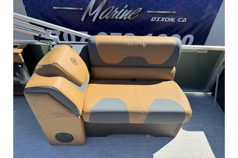 Slide: The Image of 2026 Tahoe Pontoon Geofish RF 21 tan and gray seating on boat deck. - 21