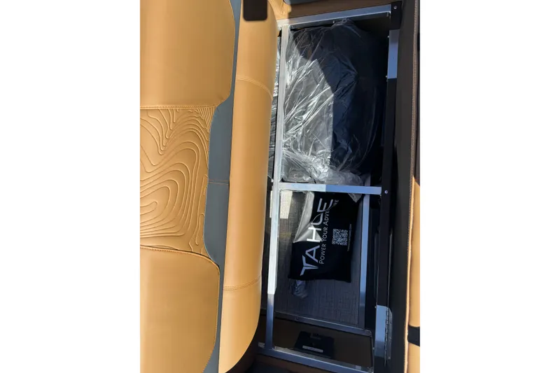 Slide: The Image of Interior storage of 2026 Tahoe Pontoon Geofish RF 21 with tan seating. - 29