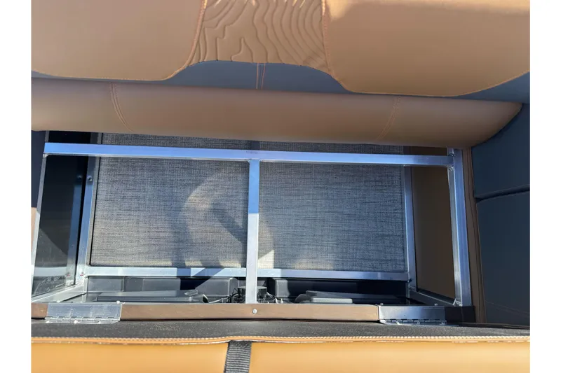 Slide: The Image of Storage compartment in 2026 Tahoe Pontoon Geofish RF 21 boat with brown seating. - 31
