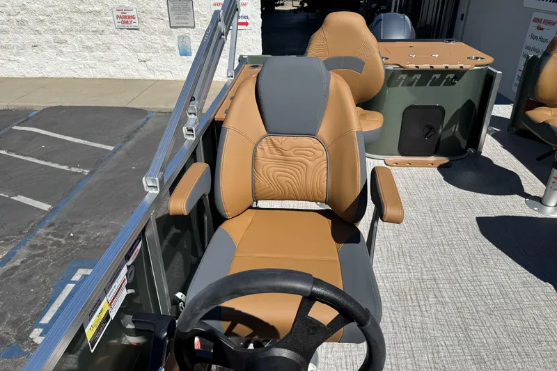 Slide: The Image of 2026 Tahoe Pontoon Geofish RF 21 captain's chair with stylish tan and gray design. - 27
