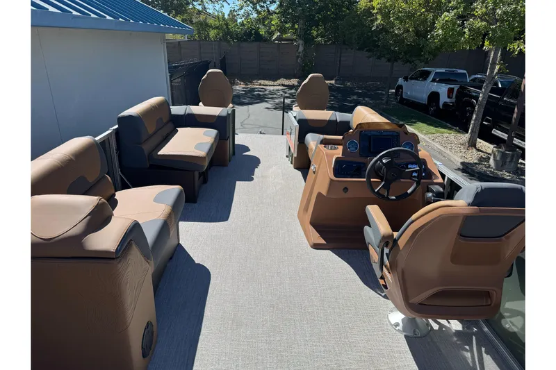 Slide: The Image of 2026 Tahoe Pontoon Geofish RF 21 interior with luxurious seating and modern dashboard. - 18