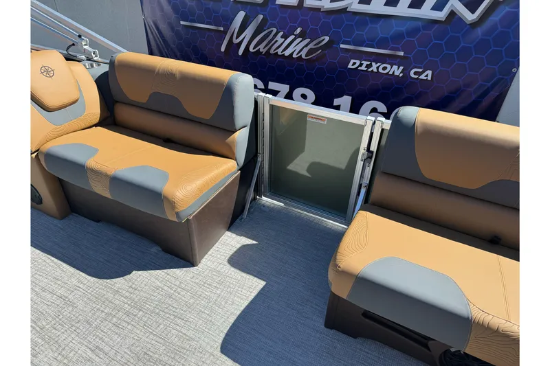 Slide: The Image of 2026 Tahoe Pontoon Geofish RF 21 interior seating with tan and gray upholstery. - 34