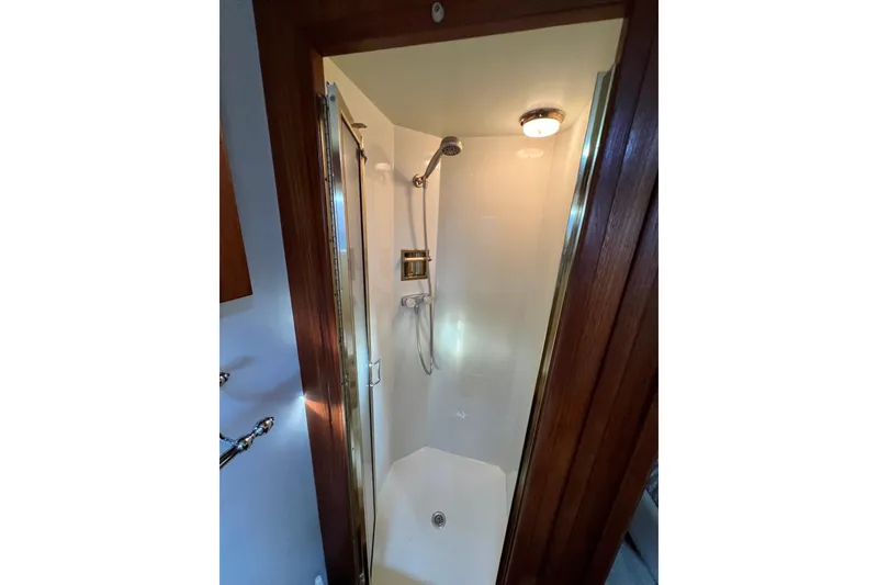Slide: The Image of Shower area in 1985 Tollycraft 48 Cockpit Motor Yacht with wooden trim. - 107