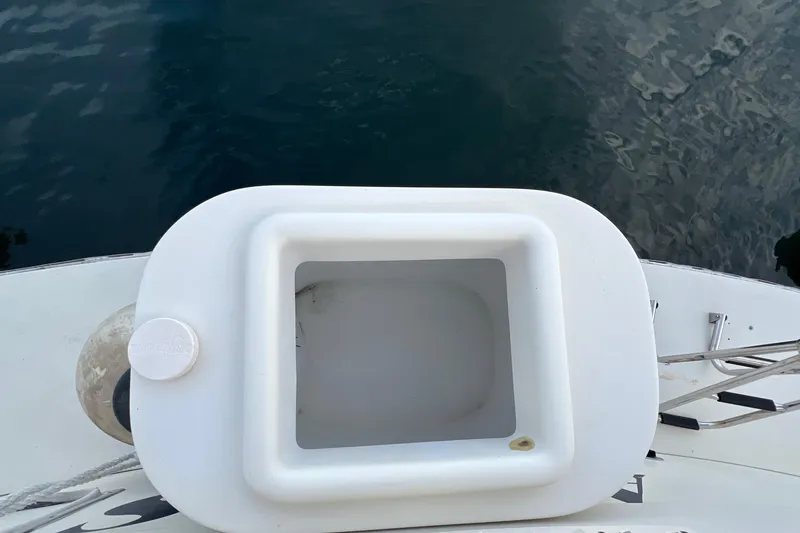 Slide: The Image of White hatch on 1985 Tollycraft 48 Cockpit Motor Yacht, near water. - 15