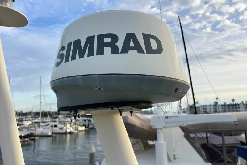 Slide: The Image of Simrad radar on 1985 Tollycraft 48 Cockpit Motor Yacht, docked in marina. - 25