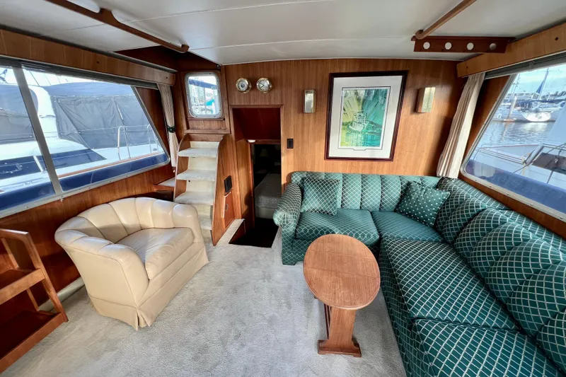 Slide: The Image of Interior of 1985 Tollycraft 48 Cockpit Motor Yacht with plush seating and nautical decor. - 38