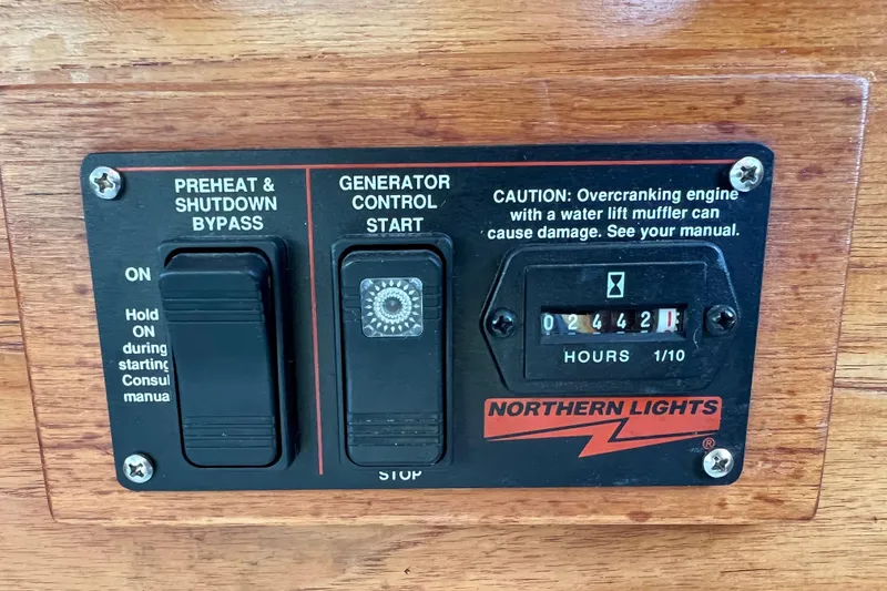 Slide: The Image of Control panel of a 1985 Tollycraft 48 Cockpit Motor Yacht with generator hour meter. - 56