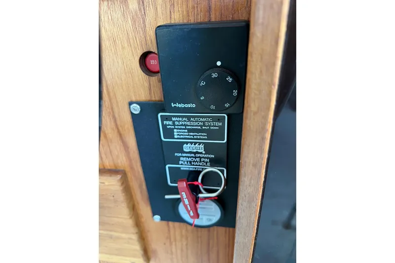 Slide: The Image of Control panel of 1985 Tollycraft 48 Cockpit Motor Yacht with fire suppression system. - 57