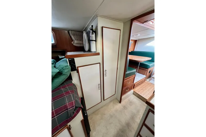 Slide: The Image of 1985 Tollycraft 48 Cockpit Motor Yacht interior with cozy cabin and dining area. - 75