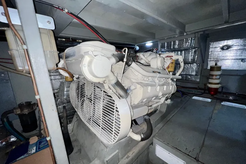 Slide: The Image of Engine room of 1985 Tollycraft 48 Cockpit Motor Yacht, featuring a Caterpillar engine. - 83