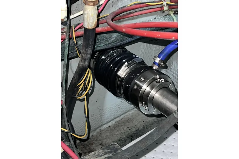 Slide: The Image of Engine compartment of 1985 Tollycraft 48 Cockpit Motor Yacht with visible wiring and components. - 87