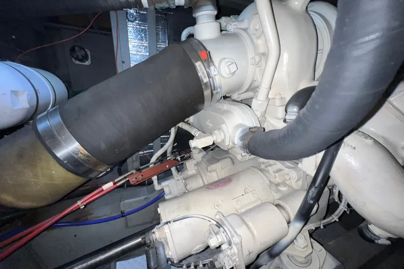 Slide: The Image of Engine compartment of a 1985 Tollycraft 48 Cockpit Motor Yacht, showcasing mechanical components. - 88