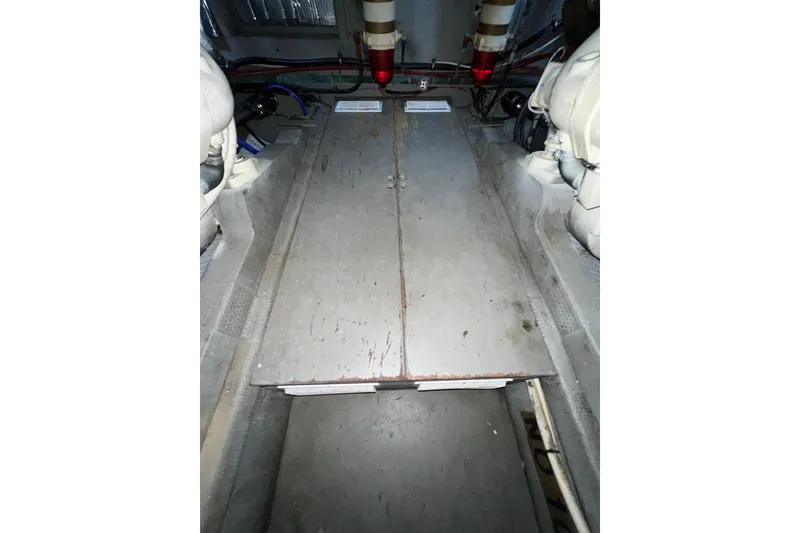 Slide: The Image of Engine room of 1985 Tollycraft 48 Cockpit Motor Yacht, featuring mechanical components. - 91