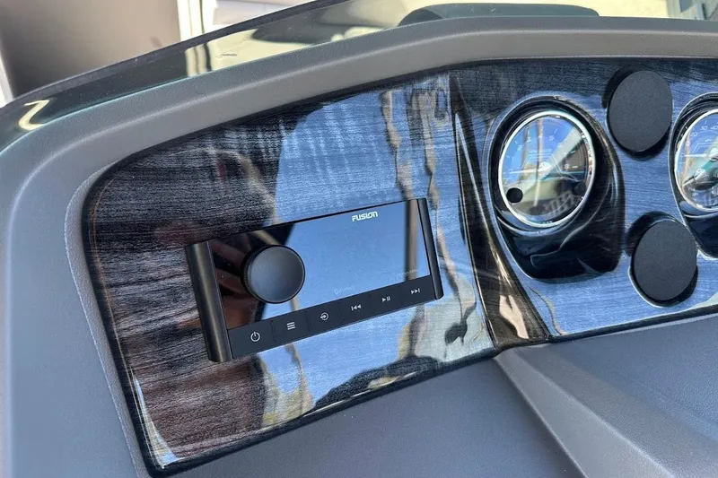 Slide: The Image of Dashboard of 2026 Tahoe Pontoon LTZ Quad Lounger Shift 23 with Fusion stereo system. - 14