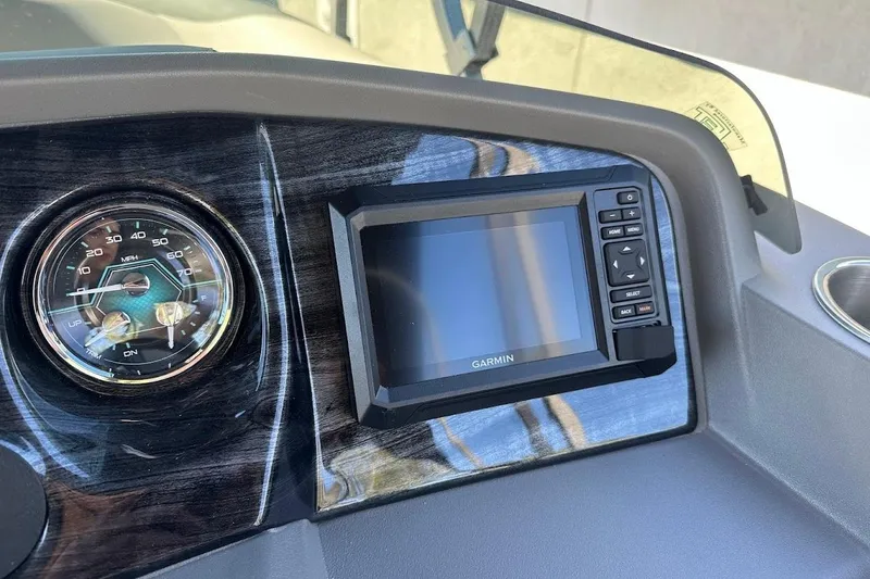 Slide: The Image of Dashboard of 2026 Tahoe Pontoon LTZ Quad Lounger Shift 23 with Garmin display. - 15