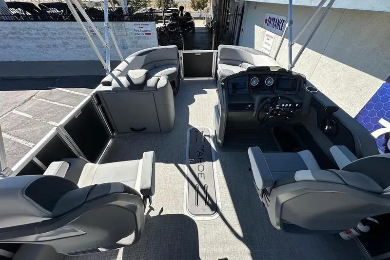 Slide: The Image of 2026 Tahoe Pontoon LTZ Quad Lounger Shift 23 interior with modern seating and controls. - 19