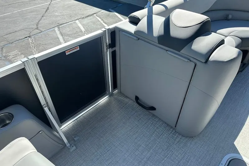 Slide: The Image of 2026 Tahoe Pontoon LTZ Quad Lounger Shift 23 interior with gray seating and flooring. - 20