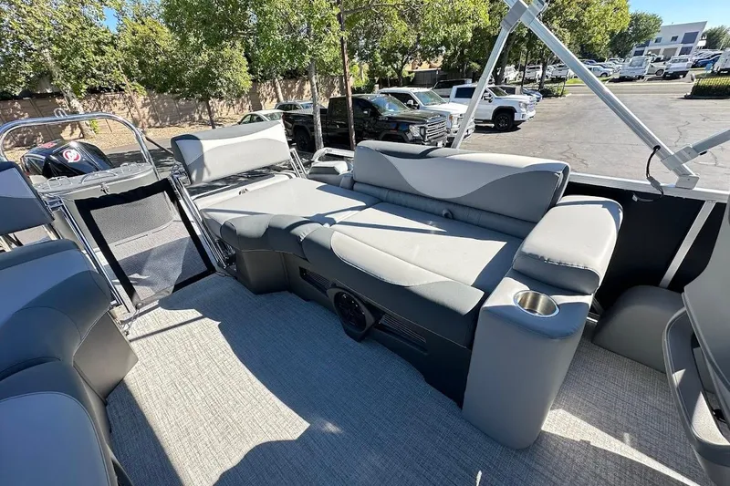Slide: The Image of 2026 Tahoe Pontoon LTZ Quad Lounger Shift 23 with luxurious seating and modern design. - 24