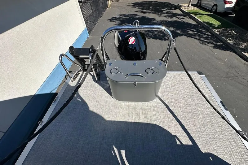 Slide: The Image of 2026 Tahoe Pontoon LTZ Quad Lounger Shift 23 rear view with motor and ladder. - 28