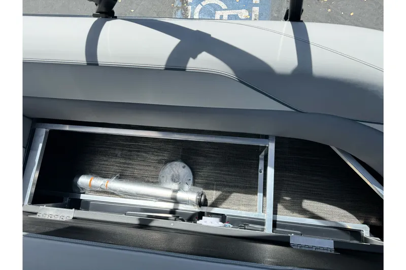 Slide: The Image of 2026 Tahoe Pontoon Sport 85 Elite Windshield 25 storage compartment detail. - 9