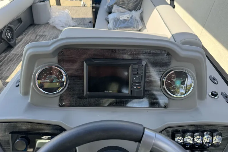 Slide: The Image of Dashboard of 2026 Tahoe Pontoon Sport 85 Elite Windshield 25 with gauges and Garmin display. - 13