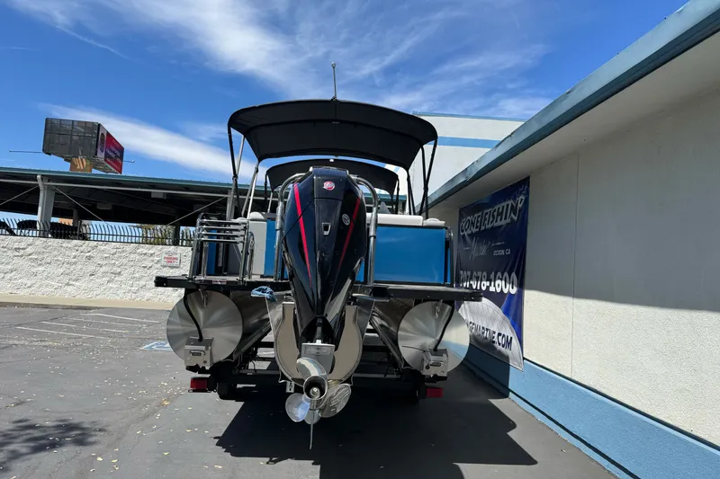 Slide: The Image of 2026 Tahoe Pontoon Sport 85 Elite Windshield 25, parked outdoors, rear view. - 3