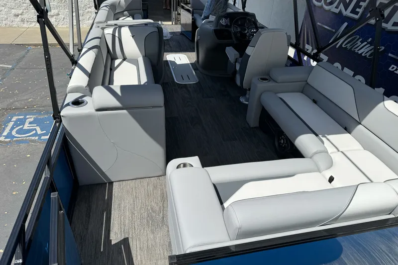 Slide: The Image of 2026 Tahoe Pontoon Sport 85 Elite Windshield 25 interior with luxurious seating and modern design. - 18