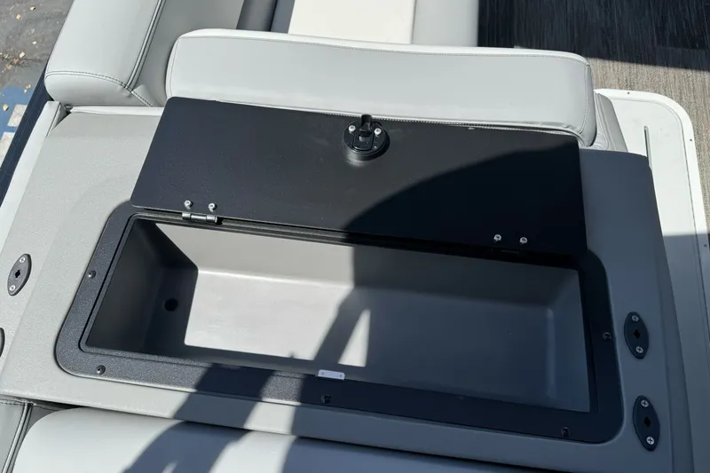 Slide: The Image of Open storage compartment on 2026 Tahoe Pontoon Sport 85 Elite Windshield 25 boat. - 15