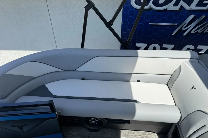 Slide: The Image of 2026 Tahoe Pontoon Sport 85 Elite Windshield 25 interior seating, featuring sleek gray upholstery. - 7