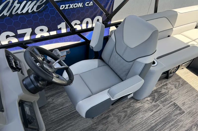 Slide: The Image of Luxurious 2026 Tahoe Pontoon Sport 85 Elite Windshield 25 captain's chair and helm. - 11