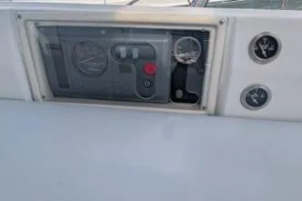 Slide: The Image of Control panel of a 2004 Hunter 33 sailboat with gauges and switches. - 14