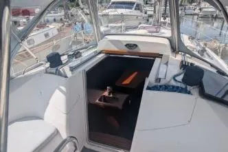 Slide: The Image of Cockpit view of a 2004 Hunter 33 sailboat docked at a marina. - 15