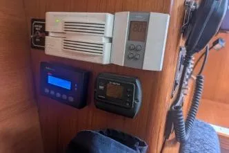 Slide: The Image of Control panel on a 2004 Hunter 33 yacht, featuring various electronic displays and devices. - 23