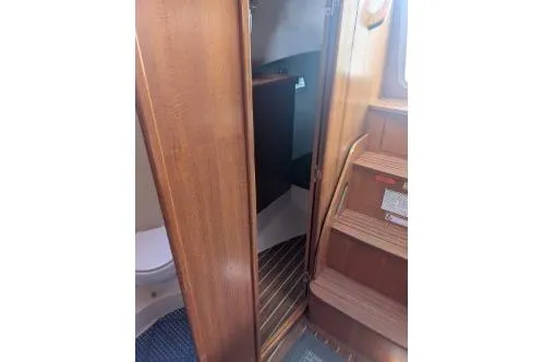 Slide: The Image of Interior view of 2004 Hunter 33 sailboat showing entry to aft master berth. - 26