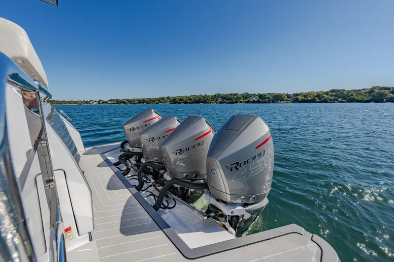 Slide: The Image of 2023 Azimut Verve 47 with powerful outboard engines on a serene lake. - 10