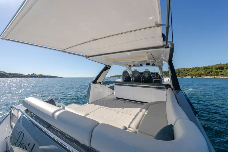 Slide: The Image of 2023 Azimut Verve 47 luxury yacht cruising on a sunny day, featuring spacious seating and sleek design. - 12