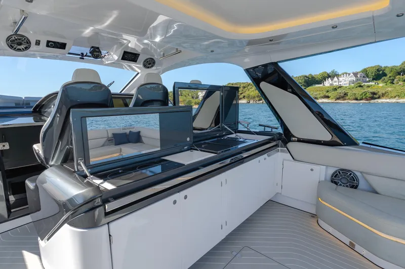 Slide: The Image of Luxurious interior of 2023 Azimut Verve 47 yacht with modern seating and scenic ocean view. - 14