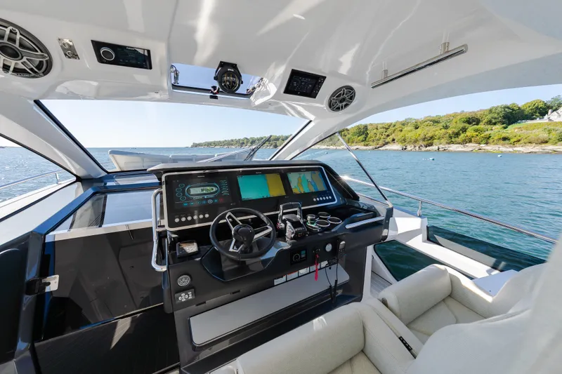 Slide: The Image of Cockpit of 2023 Azimut Verve 47 yacht with advanced navigation system and scenic ocean view. - 17