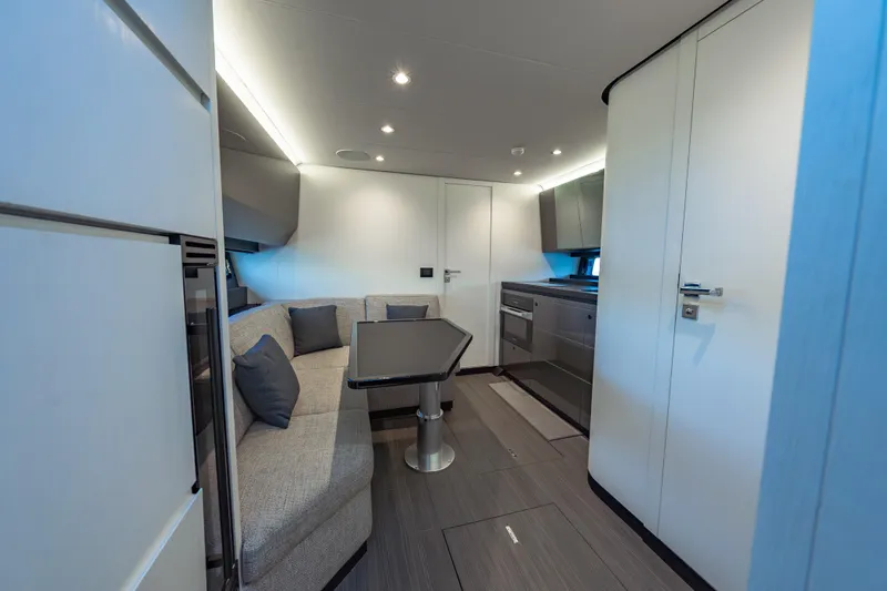 Slide: The Image of Luxurious interior of 2023 Azimut Verve 47 yacht with modern seating and kitchen area. - 21
