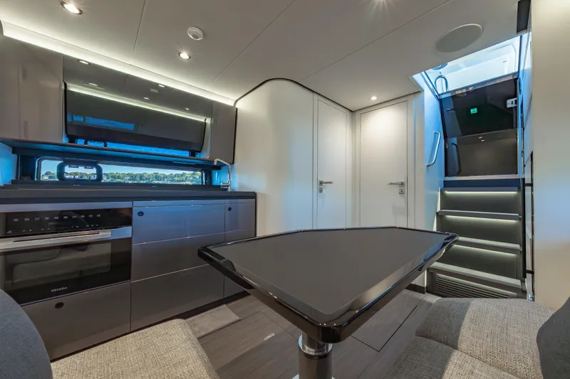Slide: The Image of Luxurious interior of 2023 Azimut Verve 47 yacht, featuring modern kitchen and sleek design. - 26