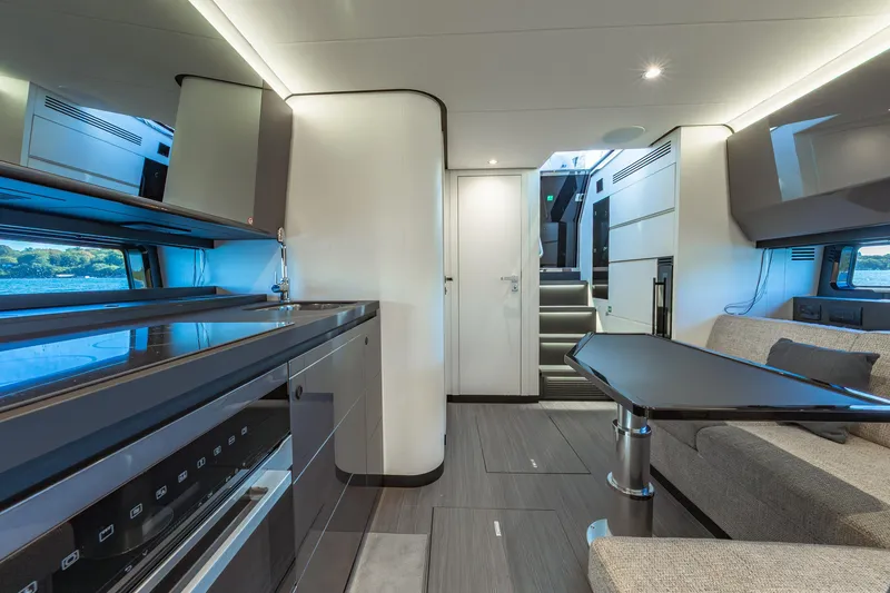 Slide: The Image of Luxurious interior of 2023 Azimut Verve 47 yacht, featuring modern kitchen and seating area. - 29